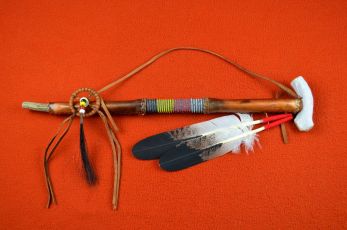 Rawhide wrapped Peace pipe